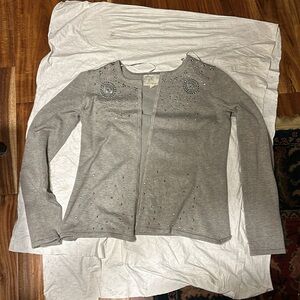 Soft sweater with sequins. Rayon and polyester. Looks like it’s never been worn.